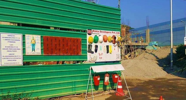 Civil contractors following safety measures at construction site